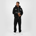 Front view of black zip hoodie Future Dreams by Rise One worn by model
